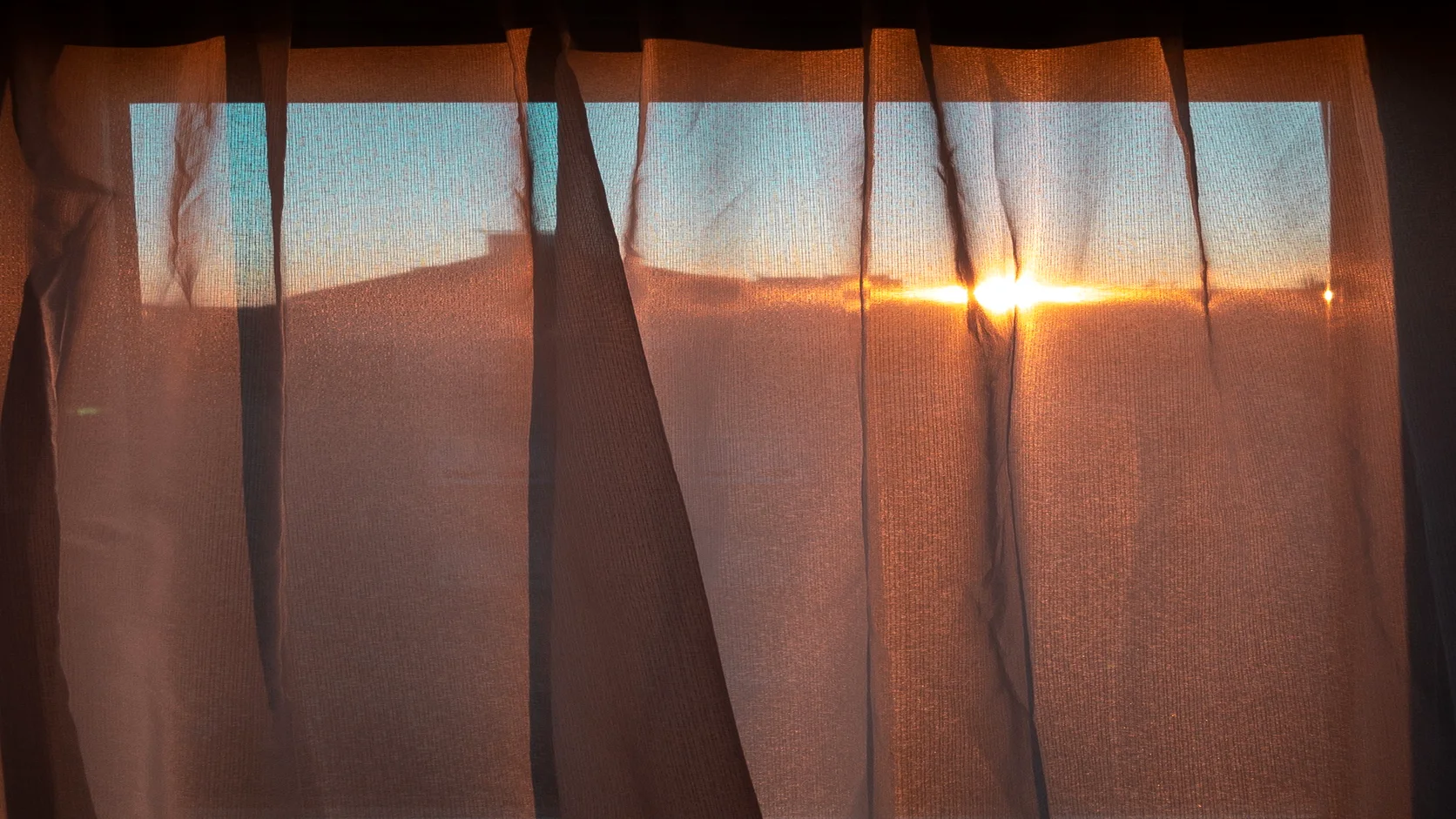 Warm light streaming through a window, expressing connection and dialogue.